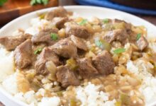 Beef tips in brown gravy over rice.